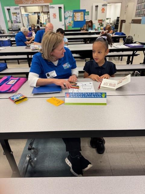 student with a reader